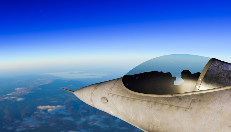 Fighter jet pilot flying high in blue sky